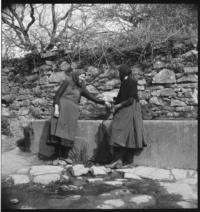 Village. At well [Women using a well] — Calisphere