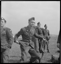 [US soldiers (Airborne) at airfied, probably departing on leave for Nice, in the United States Riviera Rest Area (USRRA).] [Misidentified in logbooks as part of: Ordonnance Reims series.]