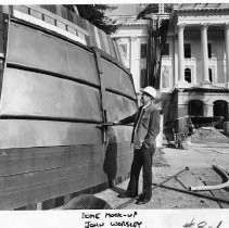 View of California State Capitol building restoration project architect, John Worsley examines a mock-up of the capitol dome