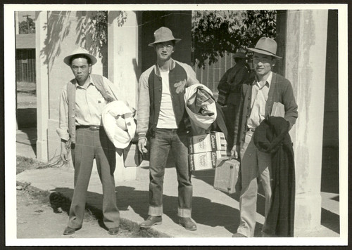 Internees walking to trains in Stockton, California