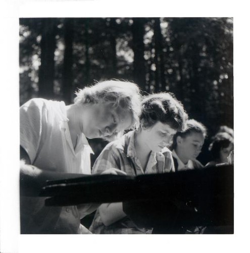 Teenage girls working at a picnic table