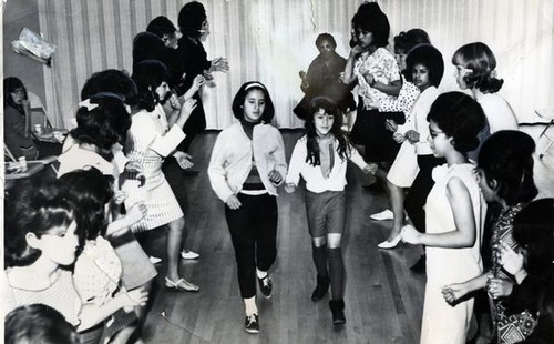 Ida Cardoza and Yolanda Gonzales doing the stroll