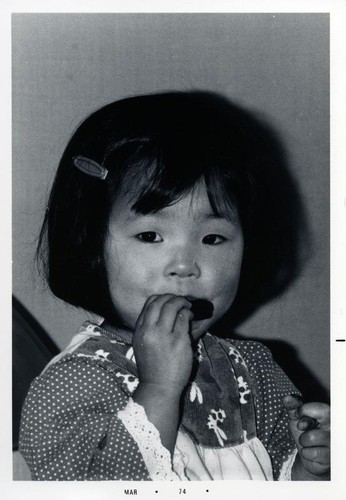 Little girl eating a cookie