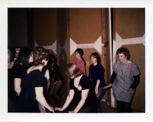 Women learning dance moves in a creative dance class