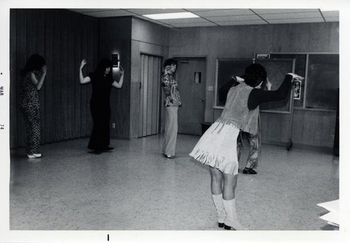 Group of women learning dance moves