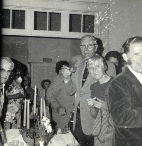 Men and women socializing around a table