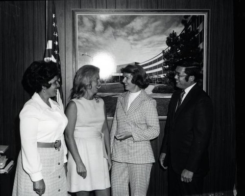 Three women posing with Mayor Norman Y. Mineta