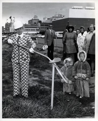 Woman with a shovel at a ground breaking