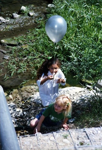 Young girls down by a stream