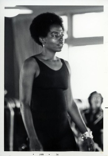 Women with an Afro hairstyle wearing a leotard