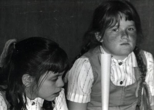 Two young girls in matching outfits