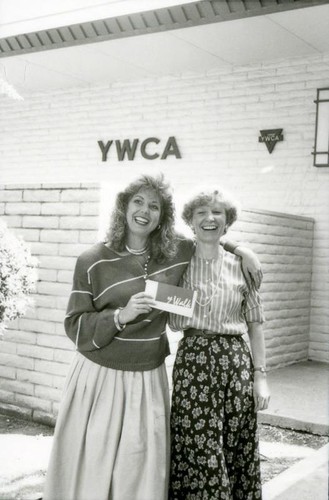 Women posing with the Y-Walk logo