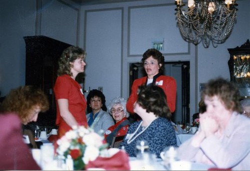 Woman speaking to a group of women