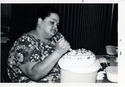 Woman decorating a cake