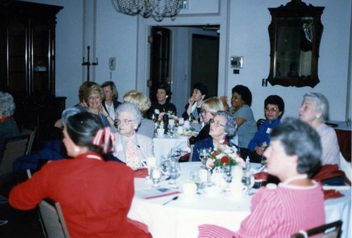 Women sitting at dining tables