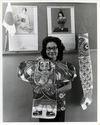 Woman posing with a Japanese warrior kite