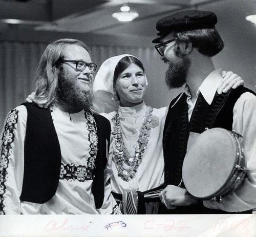 Two men and a women in traditional folk attire