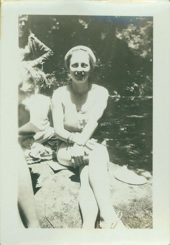 Teenage girl sitting on a rock