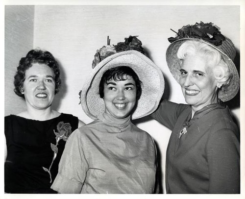 Three women posing for a group portrait