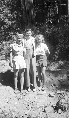 Two teenager girls and one women posing outdoors