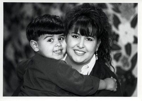 Woman holding a small boy