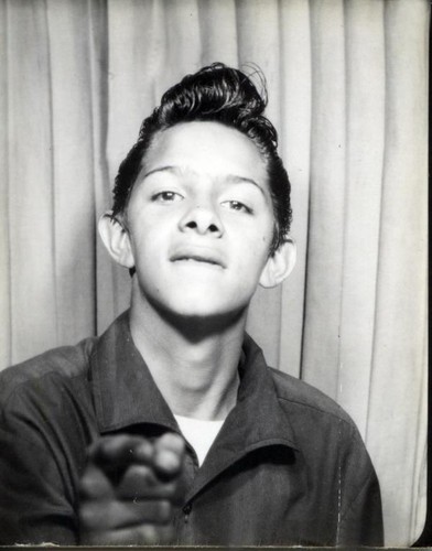 Teenage boy with a pompadour hair style