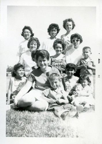 Group portrait of teenagers and children