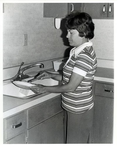 Woman washing dishes