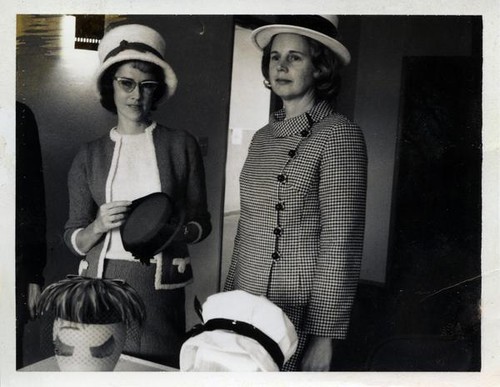 Two women wearing hats