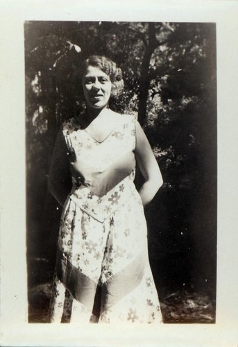 Woman posing in a wooded area