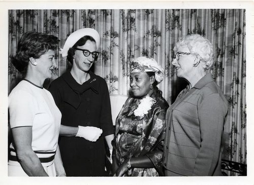 Women posing with Mrs. Jemimah Gecaga, Kenya's YWCA president