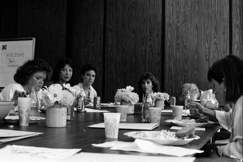 Women eating at a meeting