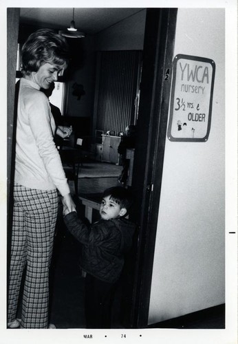 Woman and a small boy in a doorway