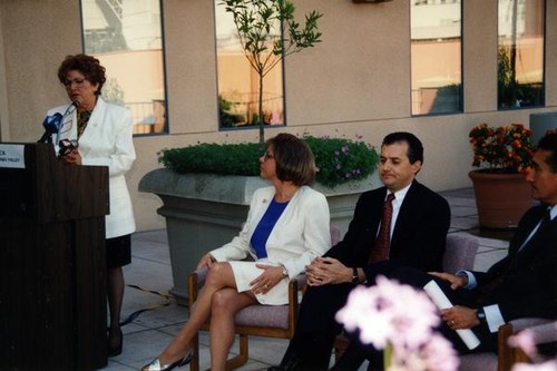 Woman speaking at a podium