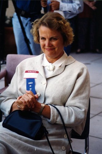 Woman wearing YWCA blue ribbon