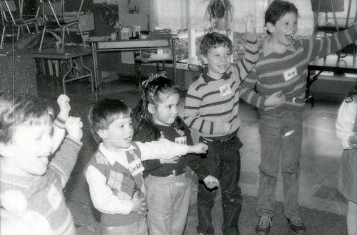 Children performing identical gestures