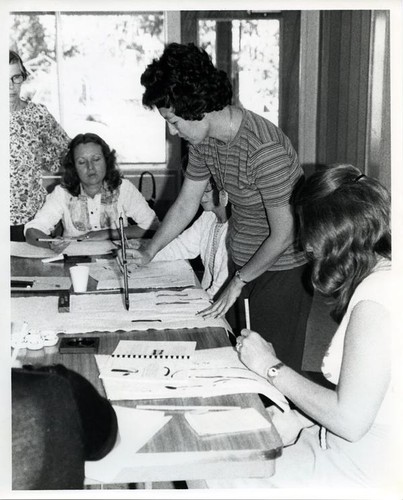 Four women practicing brush strokes