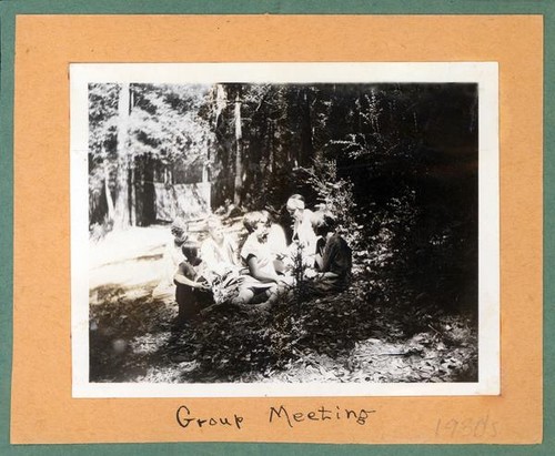 Group of girls sitting on the forest floor