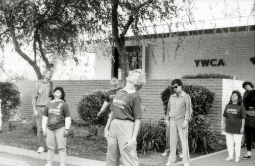 Men and women exercising outside the YWCA