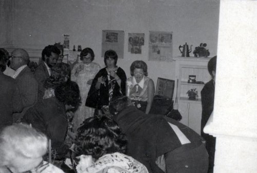 Men and women socializing at the 1973 YWCA annual meeting