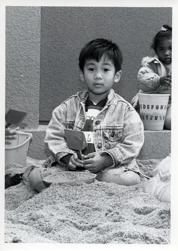 Boy playing in the sand