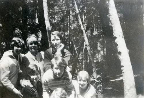 Group portrait of six teenage girls in the forest