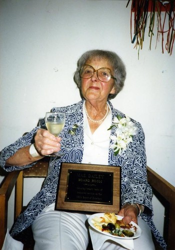 Mae Dailey posing with her plaque