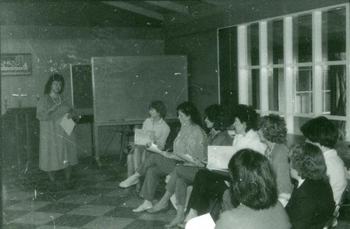 Women listening to a woman speaking