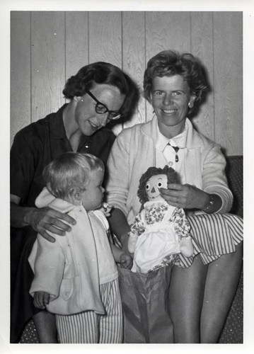 Mrs. Fred May, a toddler, and Mrs. Martin Rowe