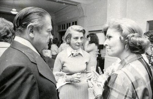 Susanne B. Wilson speaking with a man and woman