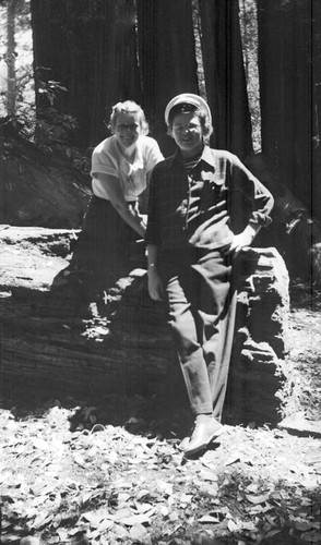 Two women posing in a redwood forest