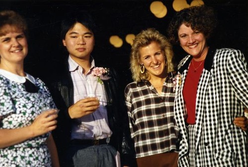 Jackye McClure posing with three people