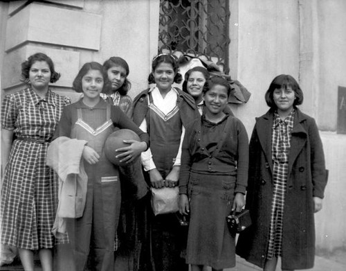 Group of teenager girls posing in front of the YWCA building