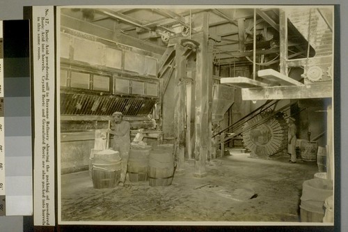 Boric Acid powdering mill in Bayonne Refinery showing the packing of powdered Boric Acid into barrels. Crystal Boric and Granulated Boric are also packed into barrels in this same room